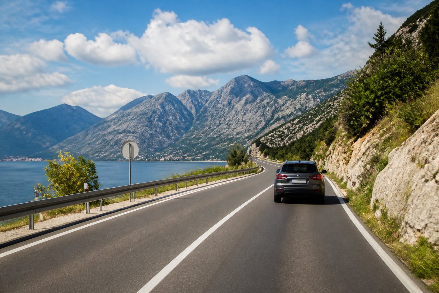 Rental car on an open Montenegro road for a one-way journey